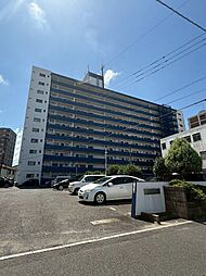 日明コータース